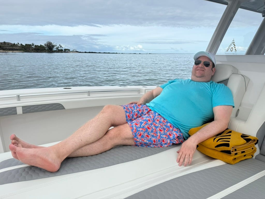 Author David Morris lying on boat