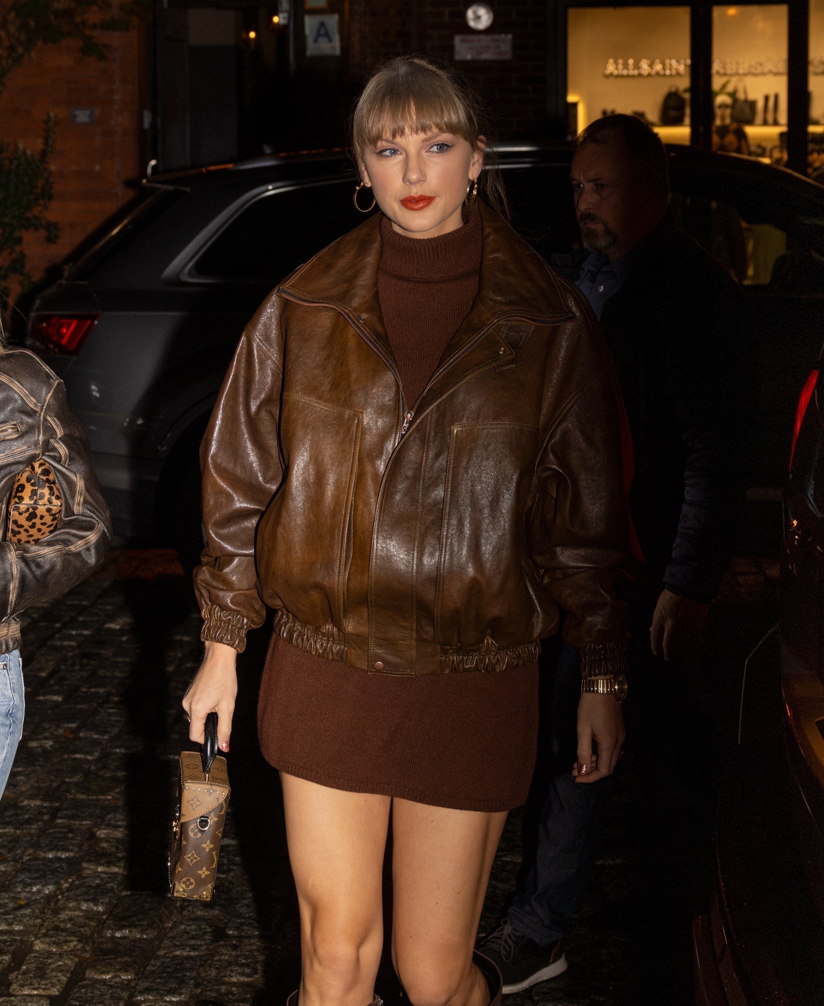Taylor Swift in a brown outfit