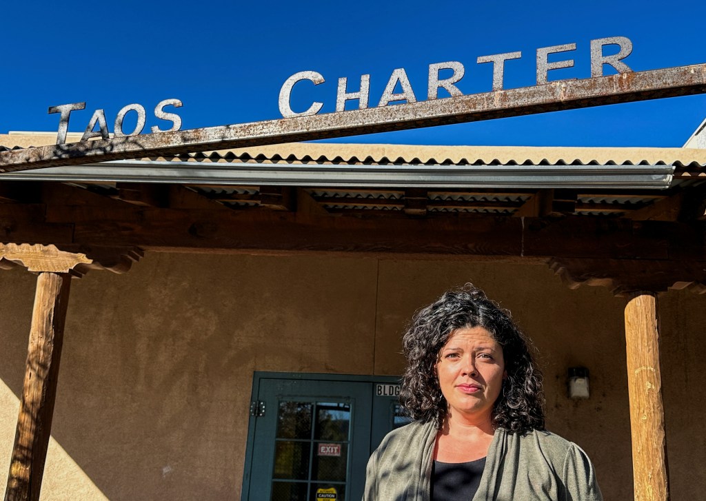 Allyson O'Brien, a special education teacher, standing outside Taos Charter School.