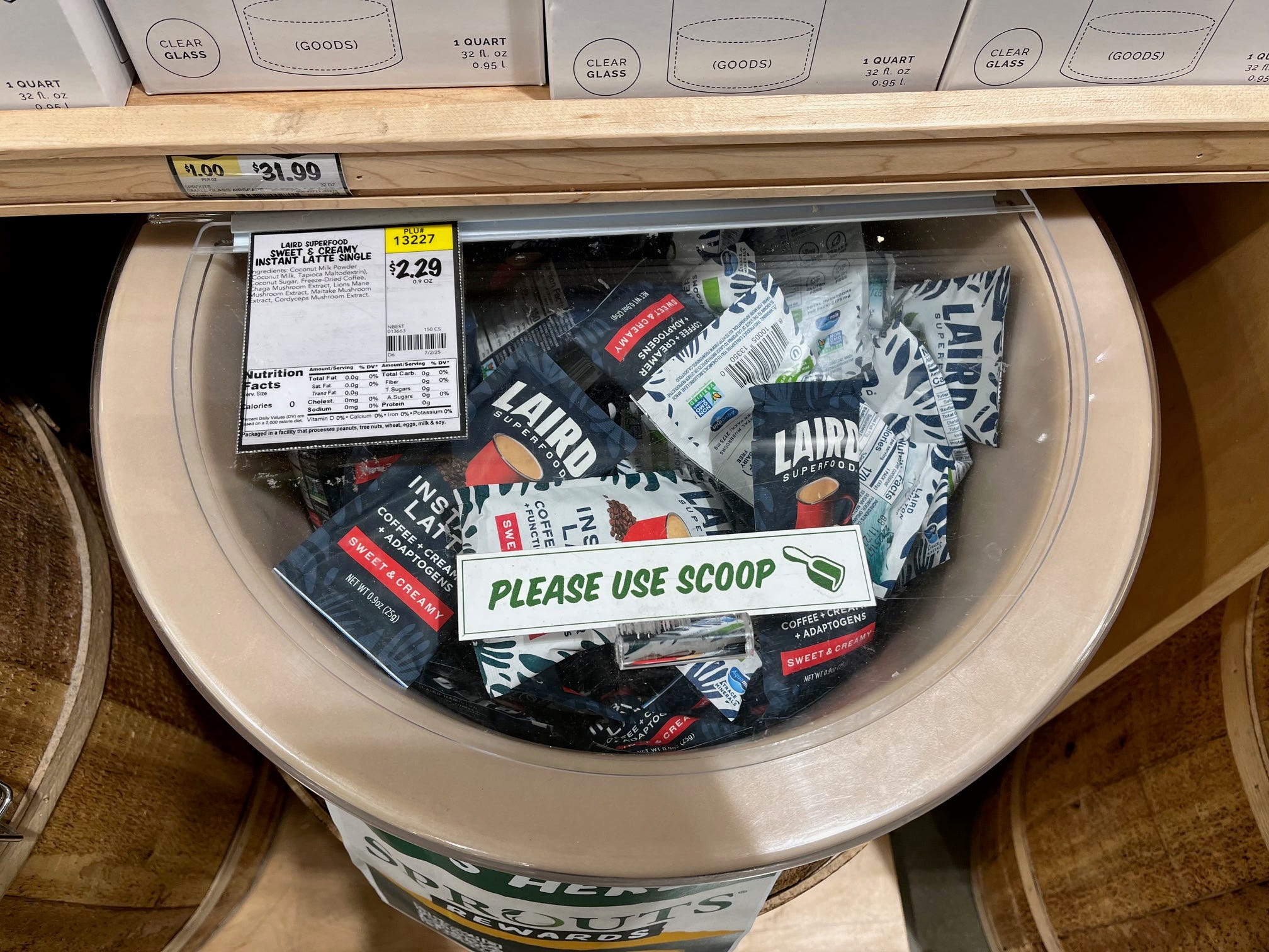 Packets of Laird Superfood Instant Latte coffee sit in a barrel at Sprouts