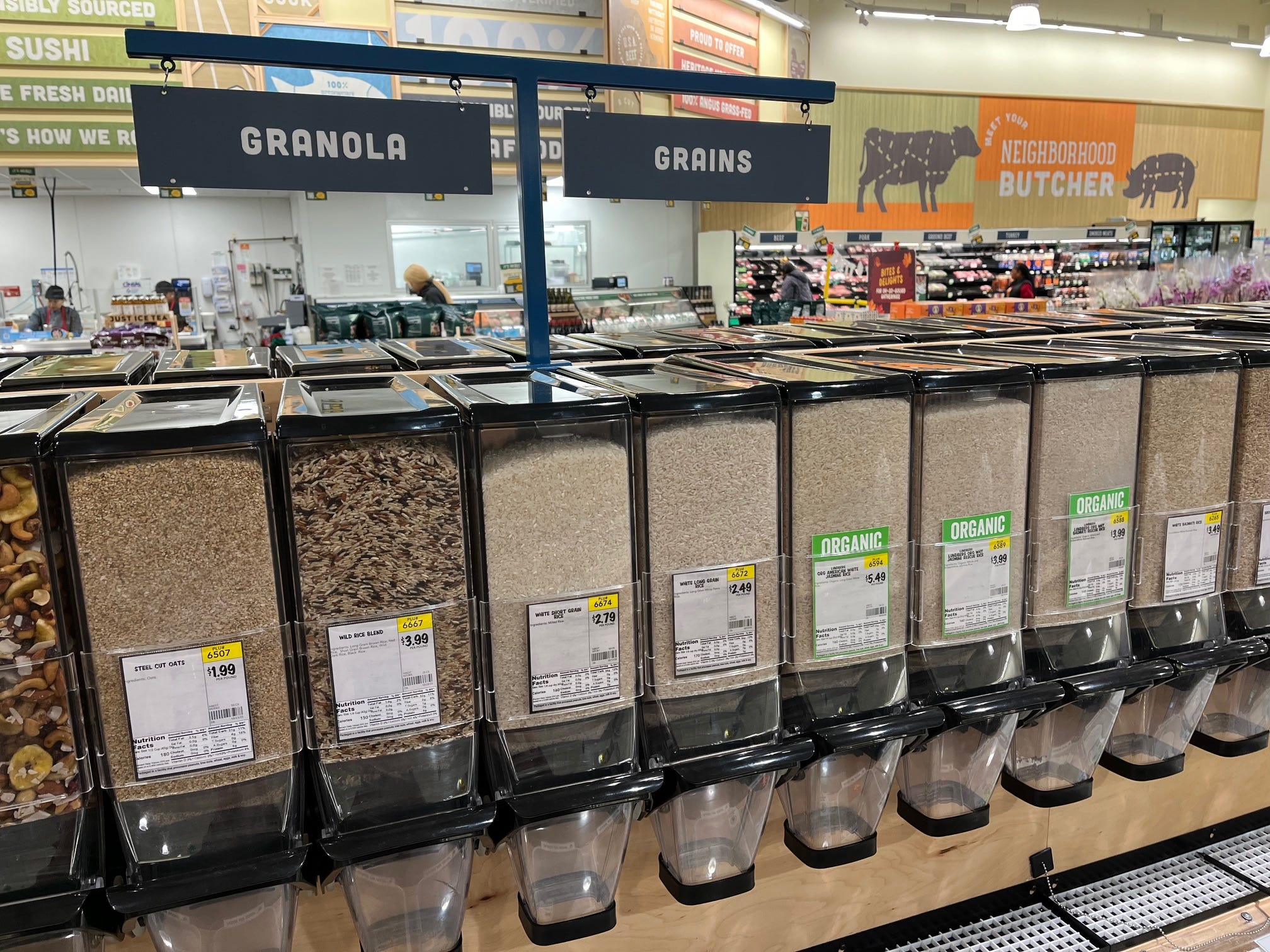 Bulk rice sits in dispensers at Sprouts