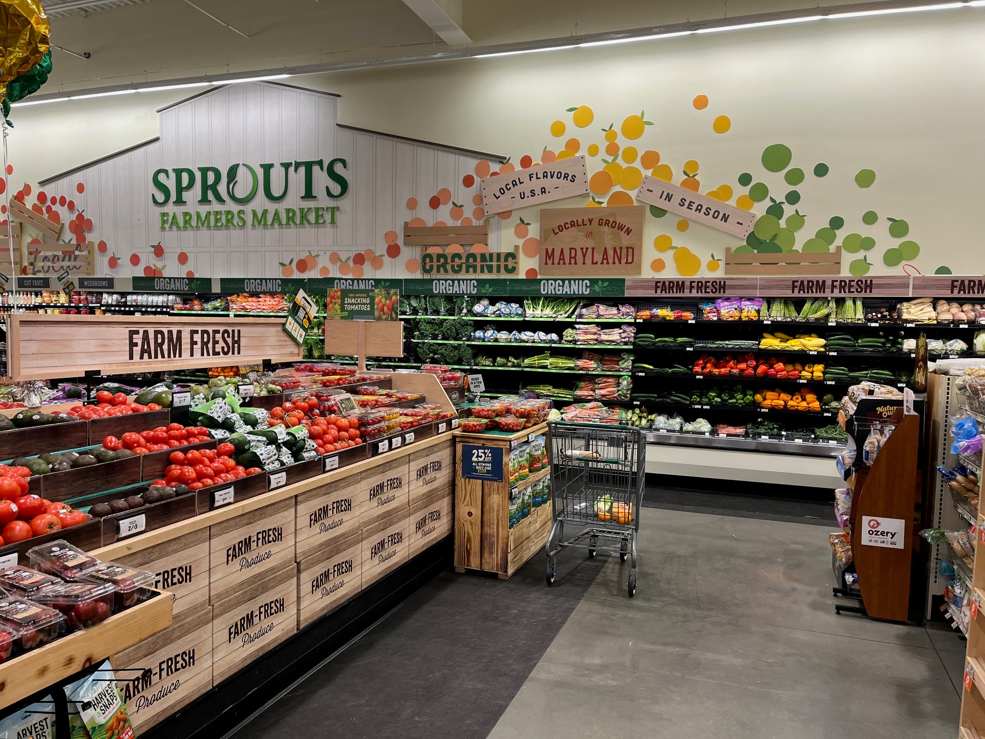 The produce section at Sprouts, including signs above that emphasize the locally grown nature of the products within