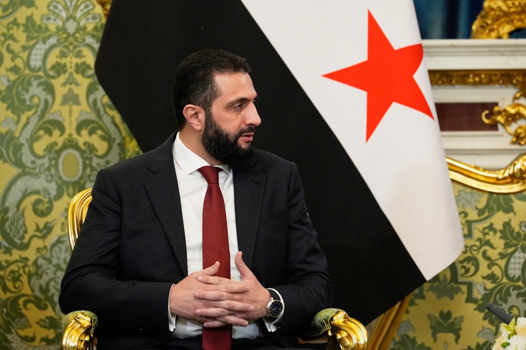 Syrian interim President Ahmad al-Sharaa speaks during a meeting with Russian President Vladimir Putin in Moscow.