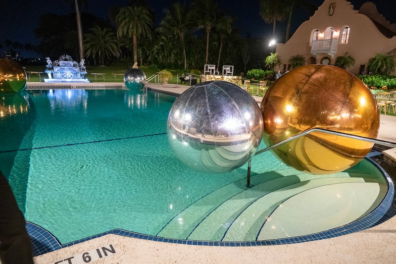 Giant balloons adorn a pool near where US President Donald Trump was hosting a Halloween party at his Mar-a-Lago residence in Palm Beach, Florida, on October 31, 2025. (Photo by ROBERTO SCHMIDT / AFP) (Photo by ROBERTO SCHMIDT/AFP via Getty Images)