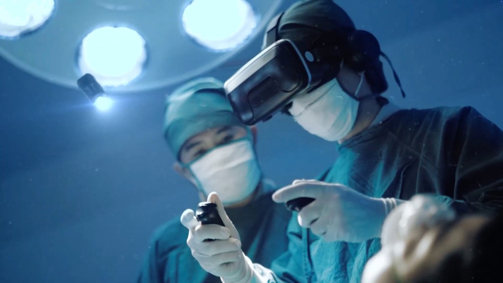 Two surgeons performing surgery while one wears a VR headset.