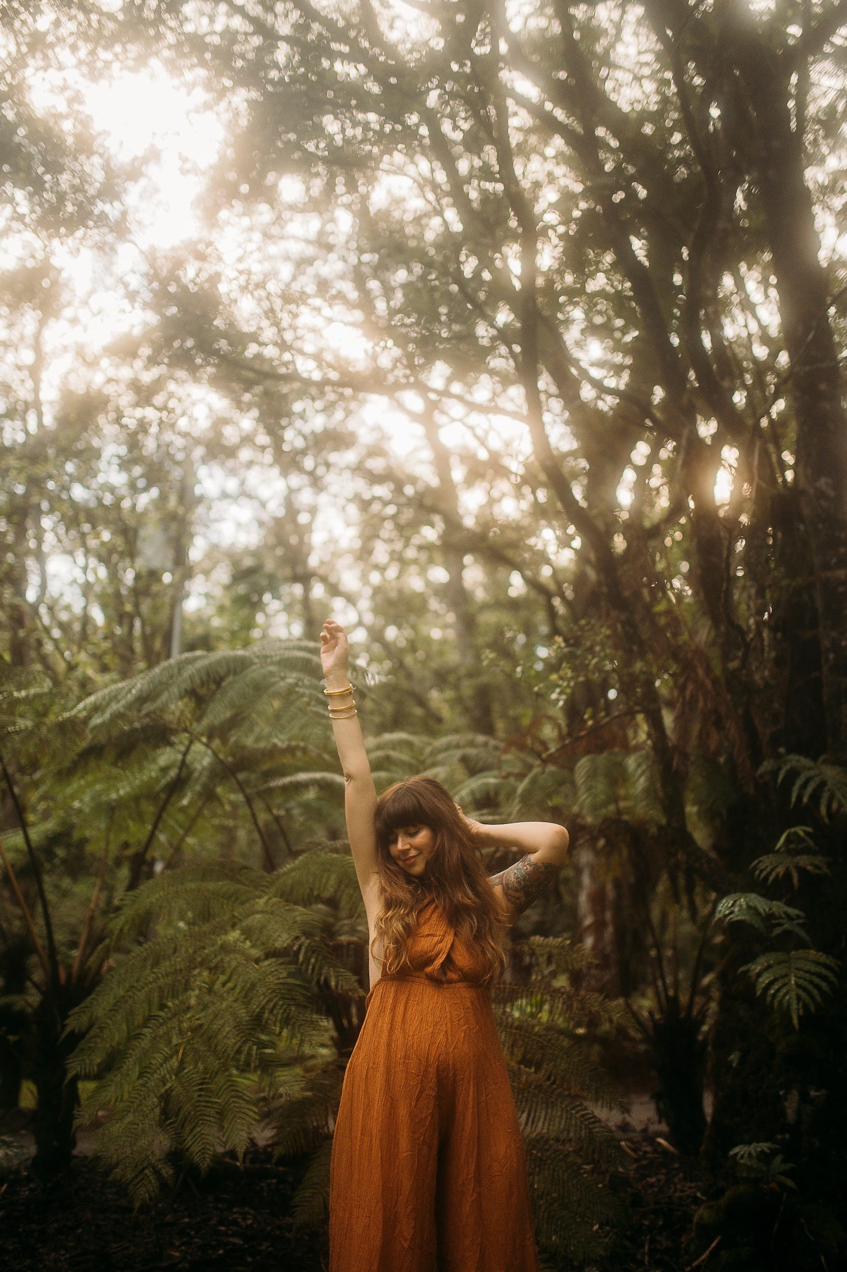 A woman posing in the forest