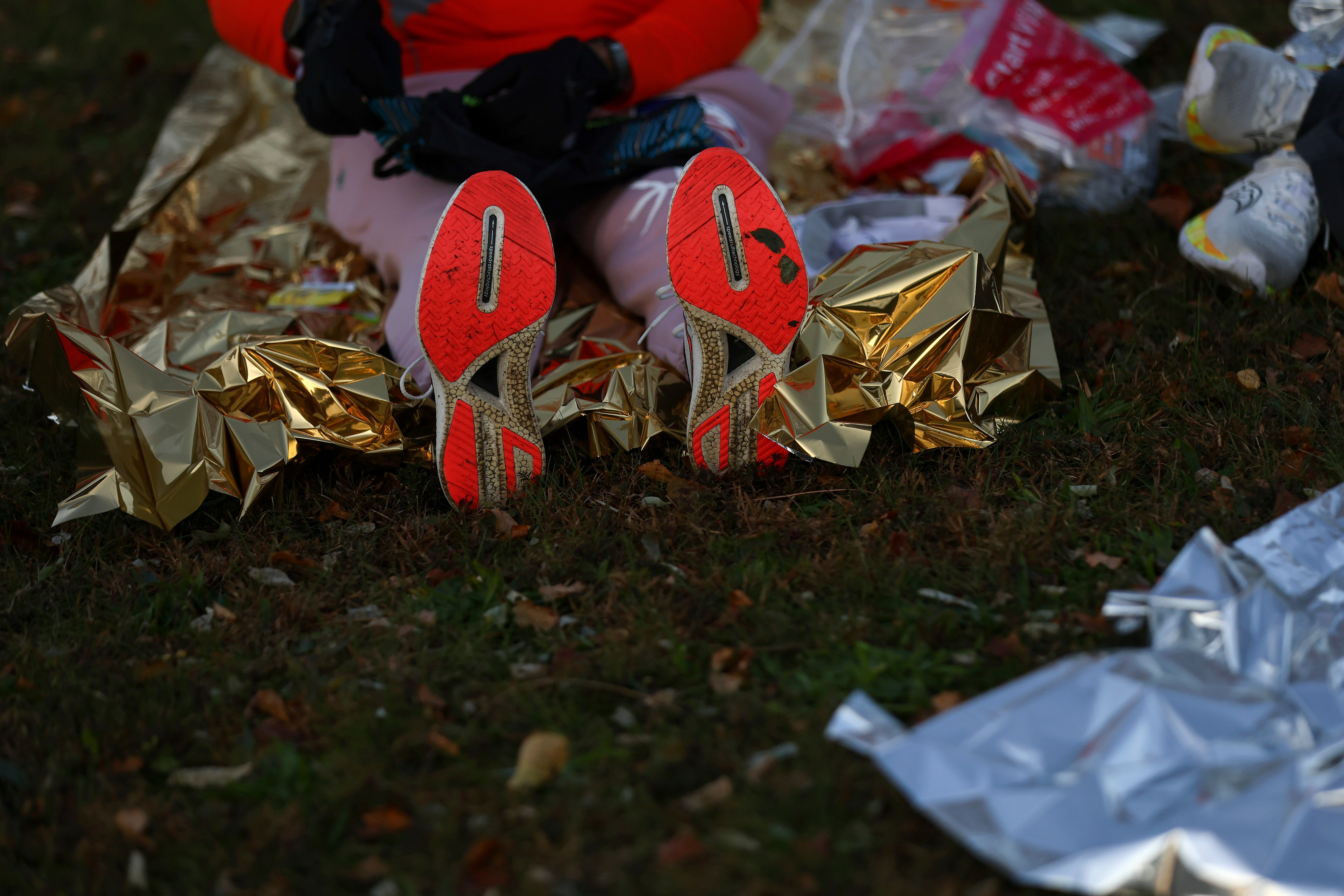 Runners wait near the base of the Verrazzano Narrows bridge for the start of the New York City Marathon, Sunday, Nov. 2, 2025, in New York.