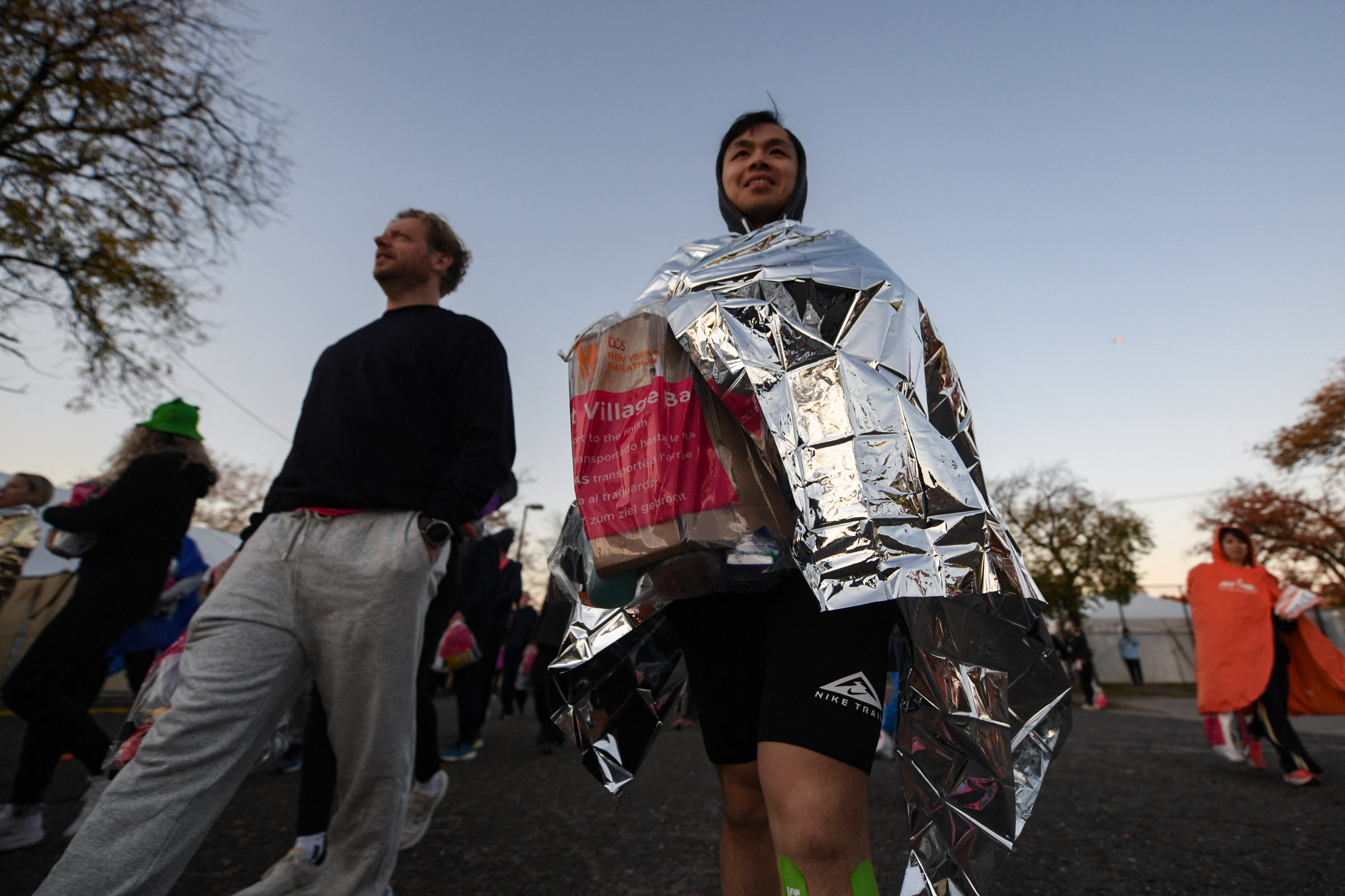 Participants head to their starting locations before the 2025 TCS New York City Marathon. 