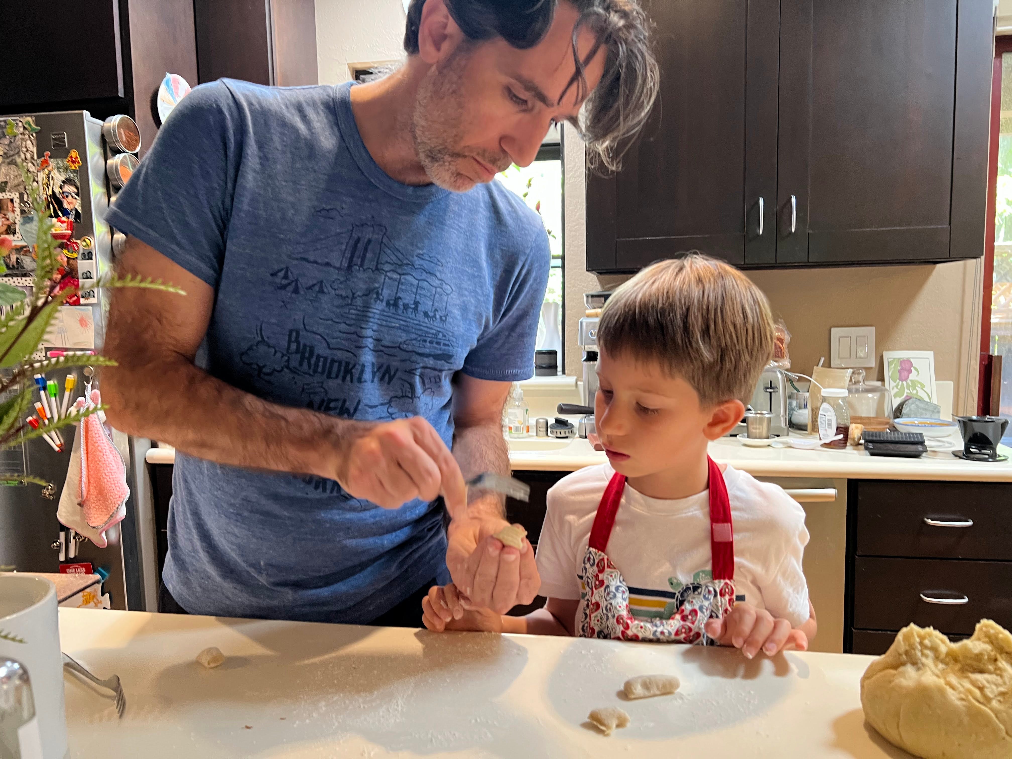 Dad teaching son to cook
