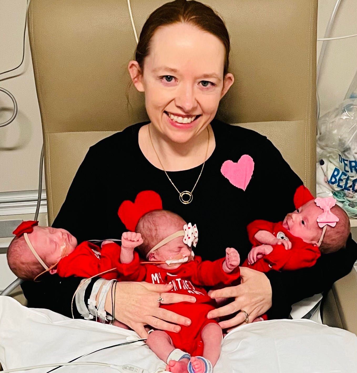 The author with her identical triplets.