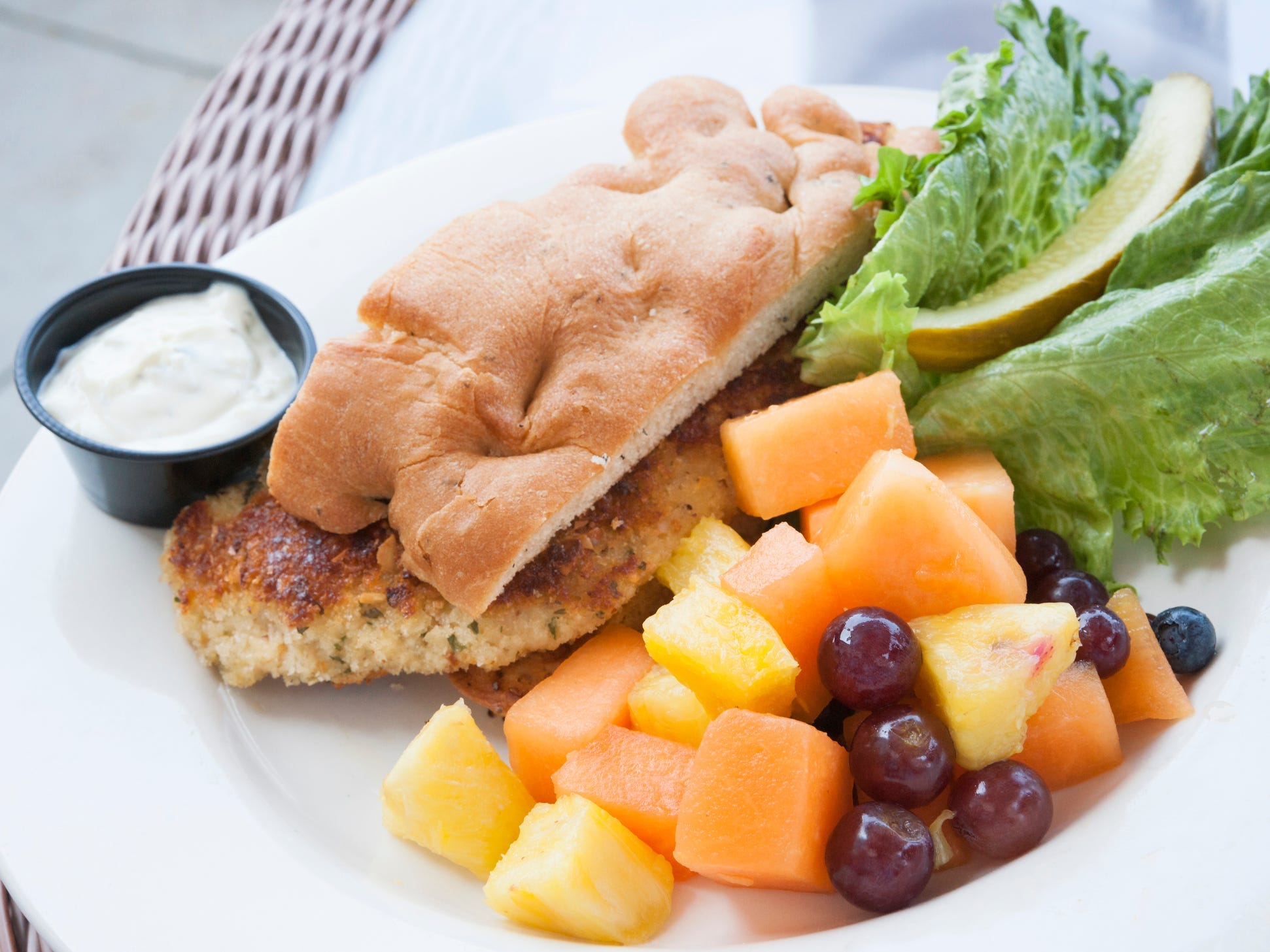 walleye sandwich with fruit on the side