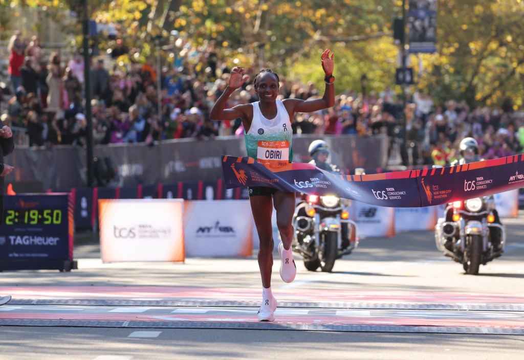 Hellen Obiri of Kenya crosses the finish line to win the New York Marathon.