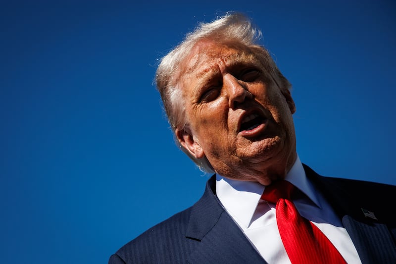 WEST PALM BEACH, FLORIDA - OCTOBER 31: US President Donald Trump speaks to reporters as he arrives at Palm Beach International Airport on October 31, 2025 in West Palm Beach, Florida. Trump is spending the weekend at his Mar-A-Lago estate in Palm Beach, Florida. (Photo by Samuel Corum/Getty Images)