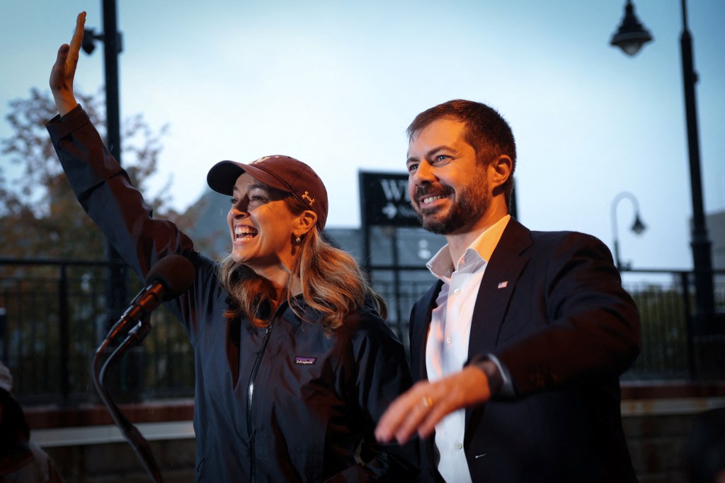 U.S. Representative Mikie Sherrill and Pete Buttigieg campaigning at a train station.