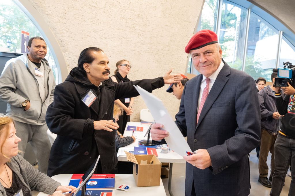 Republican mayoral candidate Curtis Sliwa registering to cast his vote at a polling station.