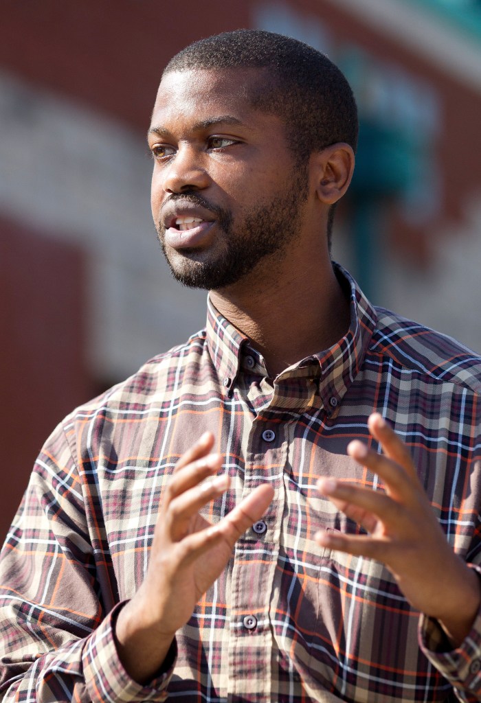 North Carolina House Rep. Cecil Brockman speaks while gesturing with his hands.