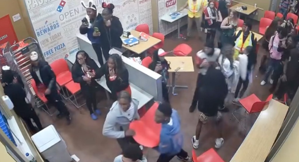 A chaotic late-night brawl broke out inside a Domino’s Pizza in Glassboro, New Jersey, over the weekend, ending with two men allegedly assaulting a police officer, according to authorities.