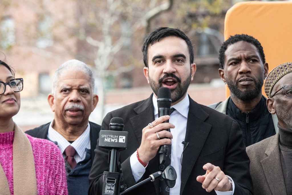 NYC mayoral candidate Zohran Mamdani speaking at a campaign event.