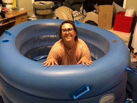 Woman inside birthing tub