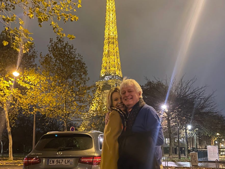 The writer and her husband in front of the Eiffel Tower in Paris.