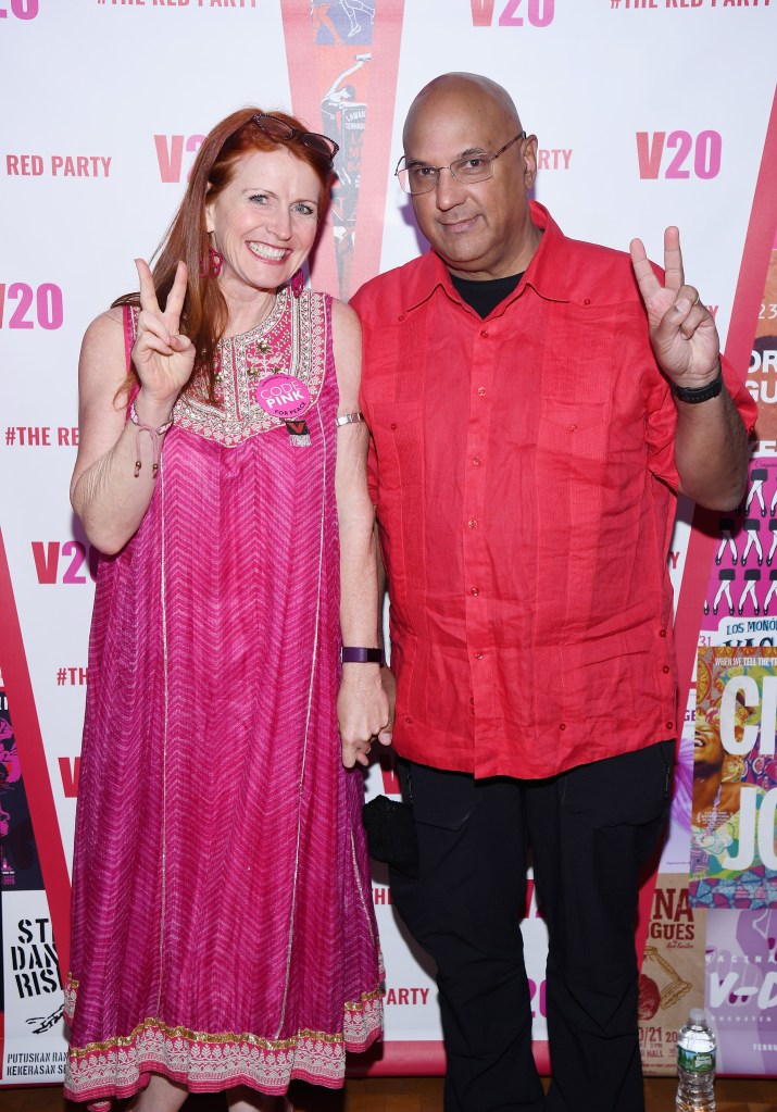 Jodie Evans and Neville Roy Singham give peace signs at The Red Party.