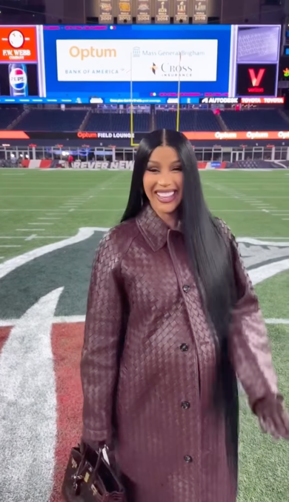 Cardi B in a head-to-toe leather outfit at a Patriots game.