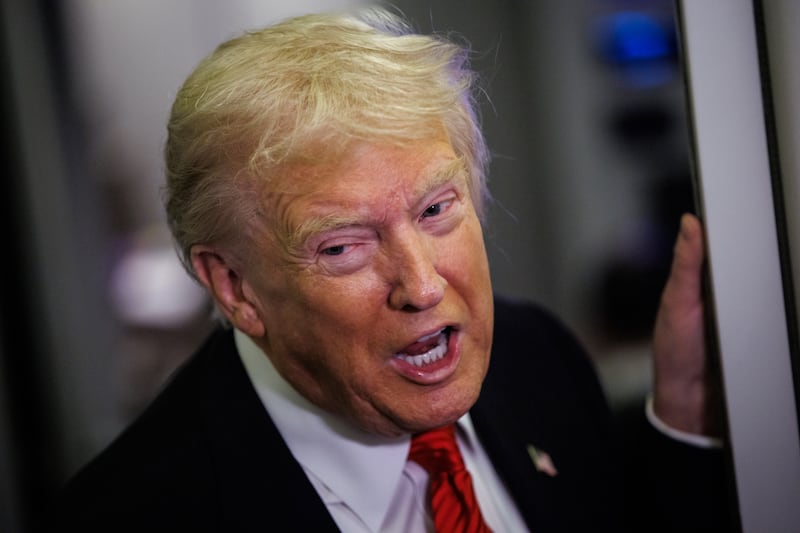 WEST PALM BEACH, FLORIDA - NOVEMBER 2: U.S. President Donald Trump speaks to reporters aboard Air Force One en route to the White House on November 2, 2025 after taking off from Palm Beach International Airport in West Palm Beach, Florida. Trump spent the weekend at his Mar-A-Lago estate in Palm Beach, Florida. (Photo by Samuel Corum/Getty Images)