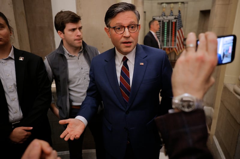 WASHINGTON, DC - OCTOBER 28: Speaker of the House Mike Johnson (R-LA) talks with reporters in the hallway outside his office following a news conference on the 28th day of the federal government shutdown at the U.S. Capitol on October 28, 2025 in Washington, DC. While keeping the House of Representatives out of session and away from Washington, Republican leaders blamed Democratic lawmakers for the continued federal government shutdown.  (Photo by Chip Somodevilla/Getty Images)