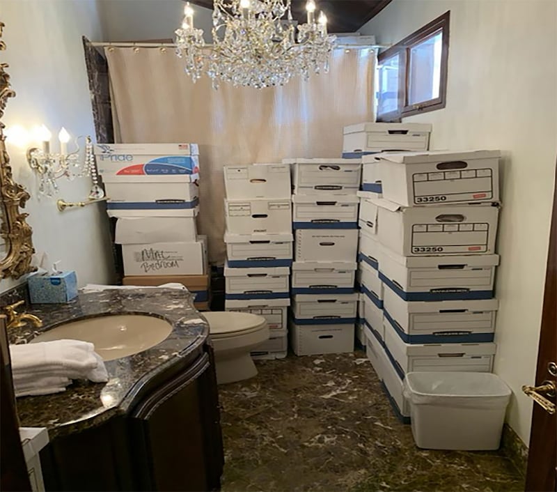 A Justice Department photo shows stacks of boxes in a bathroom and shower in The Mar-a-Lago Club’s Lake Room at Mar-a-Lago.