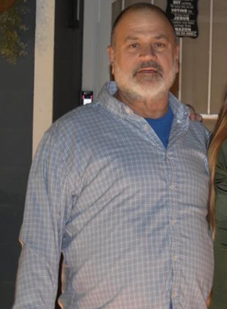 Ron Dailey, a man with a beard, in a plaid shirt.