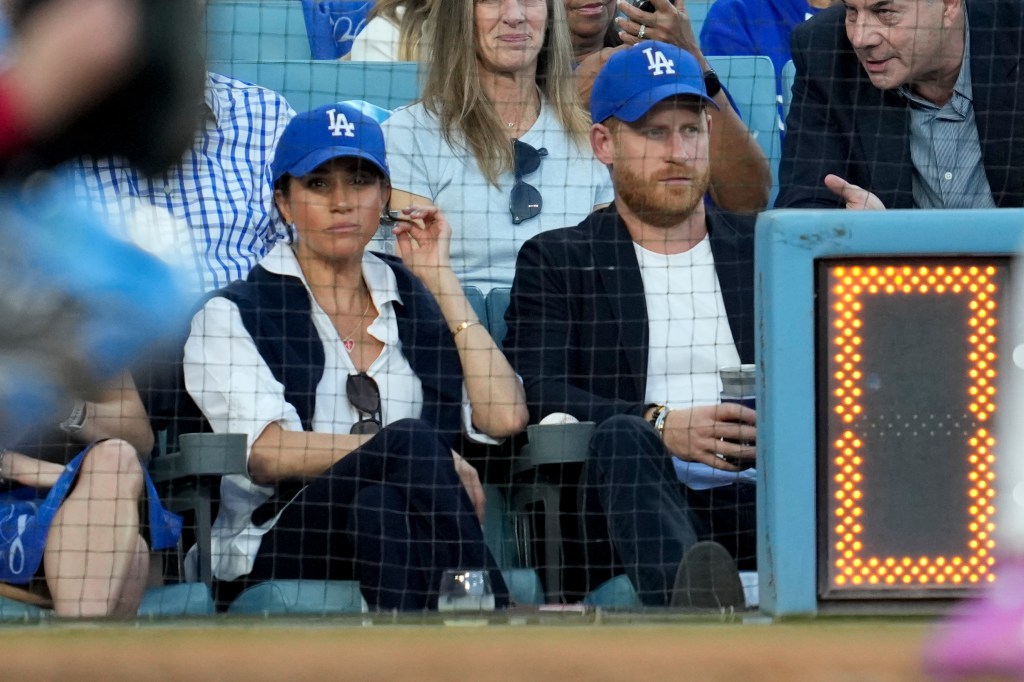 Meghan Markle and Prince Harry watching the World Series.