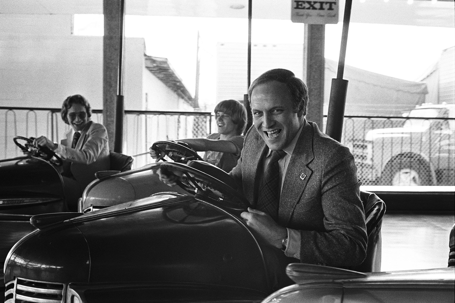 Dick Cheney rides in a bumper car.