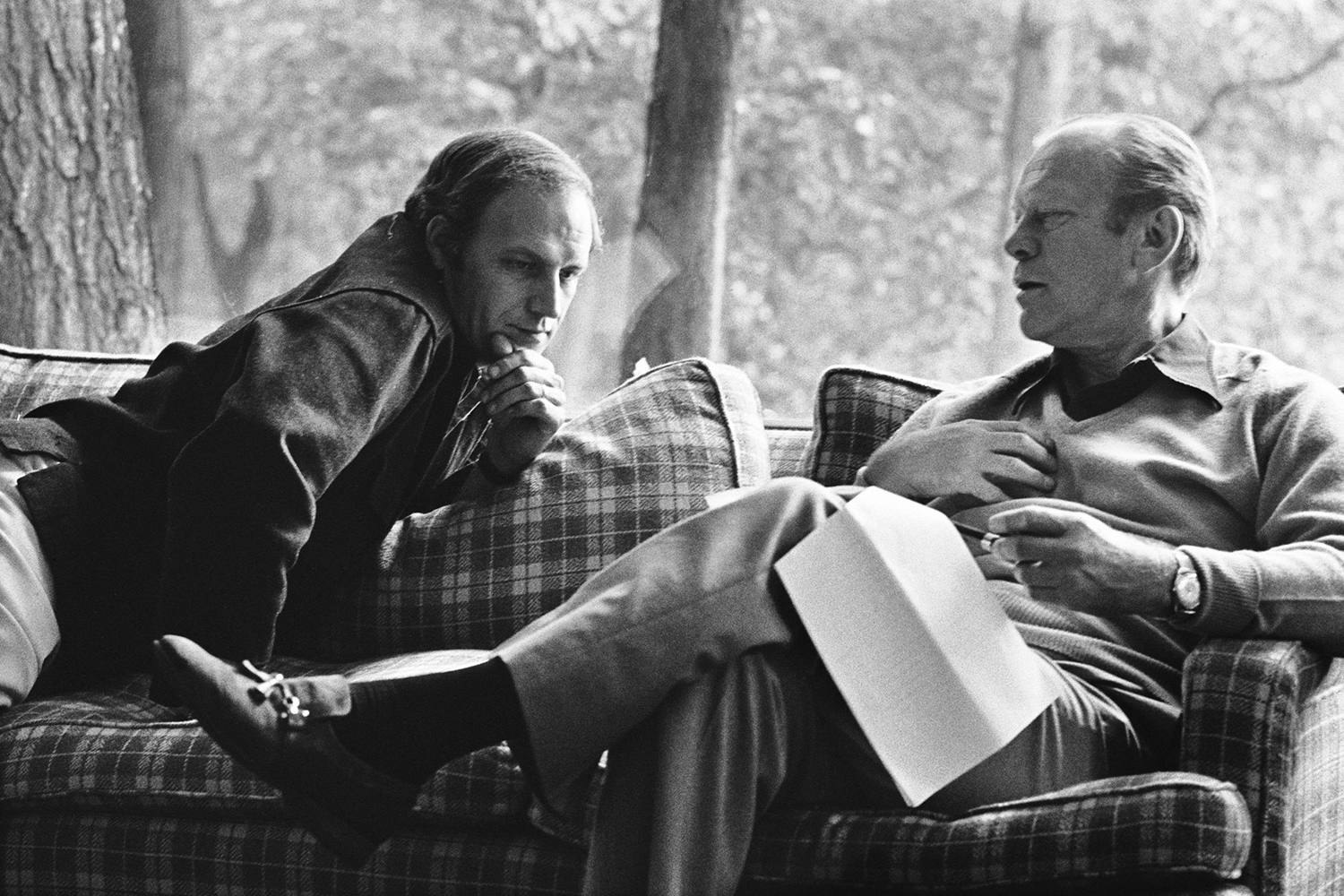Dick Cheney leans over to talk with President Gerald Ford.