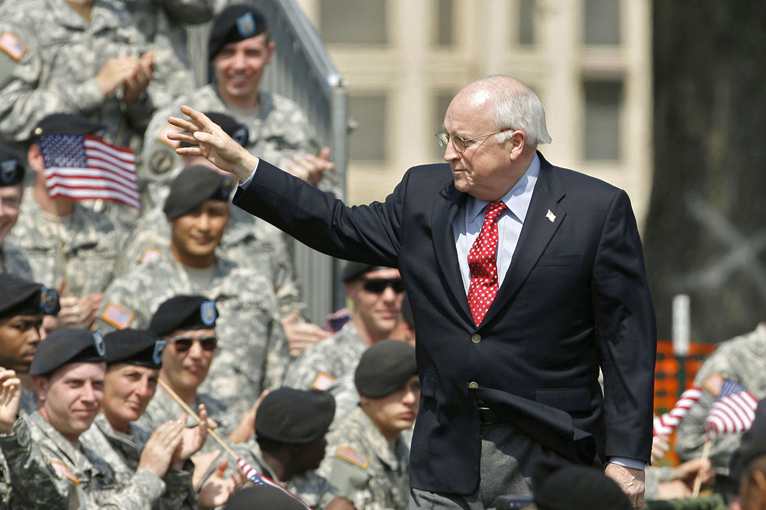 Dick Cheney waves to the troops.