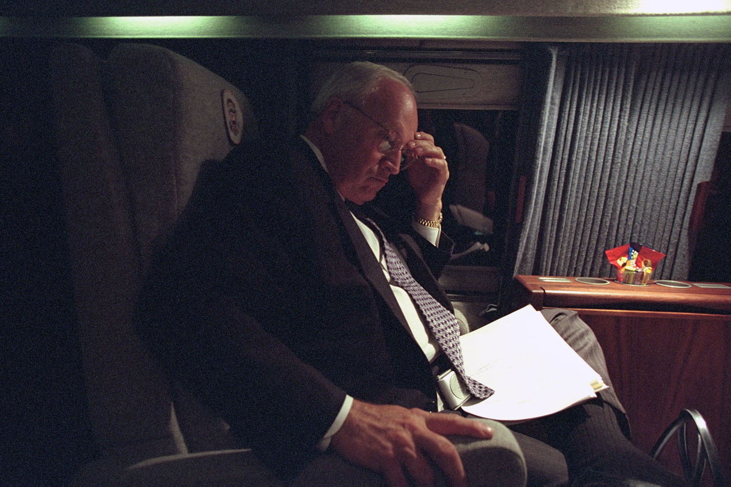 Dick Cheney sits on an airplane.