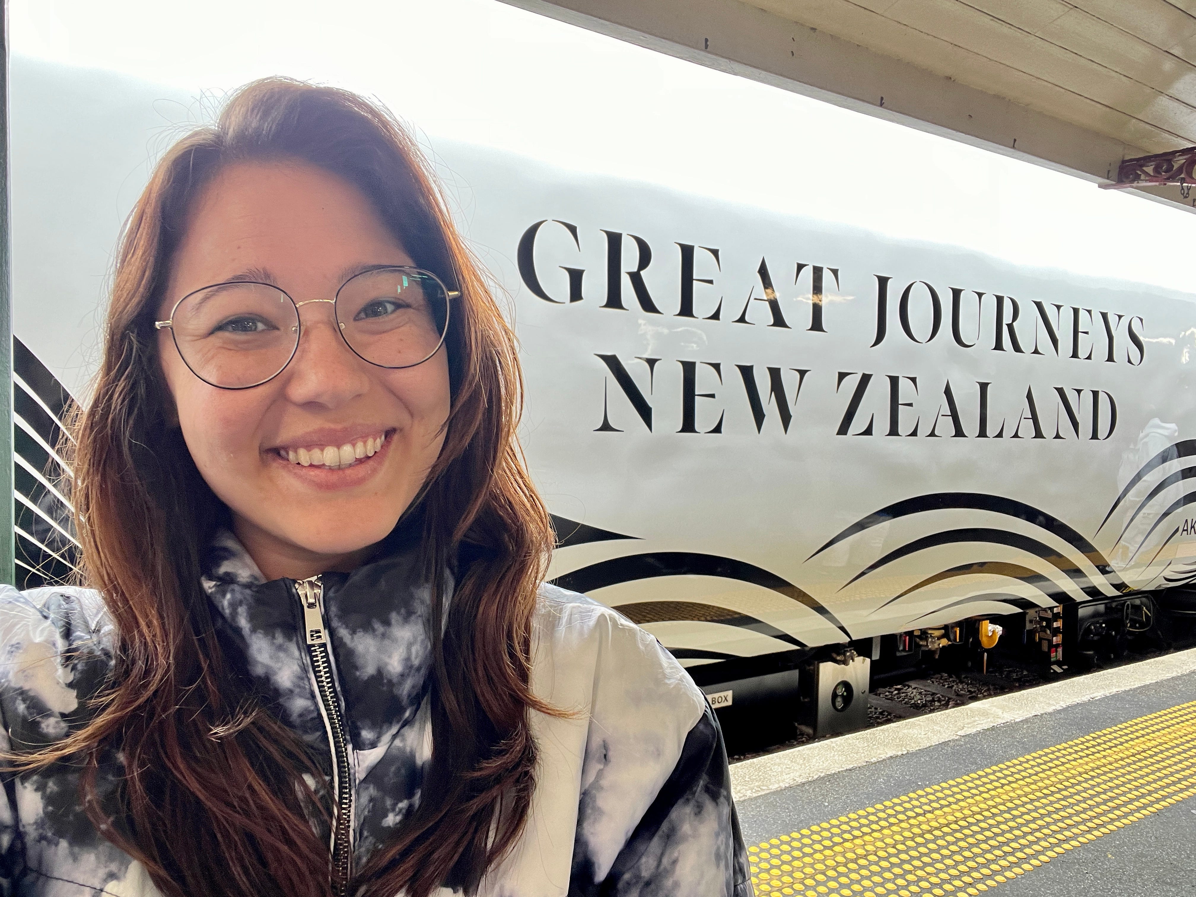 Author Ashley Probst smiling next to 