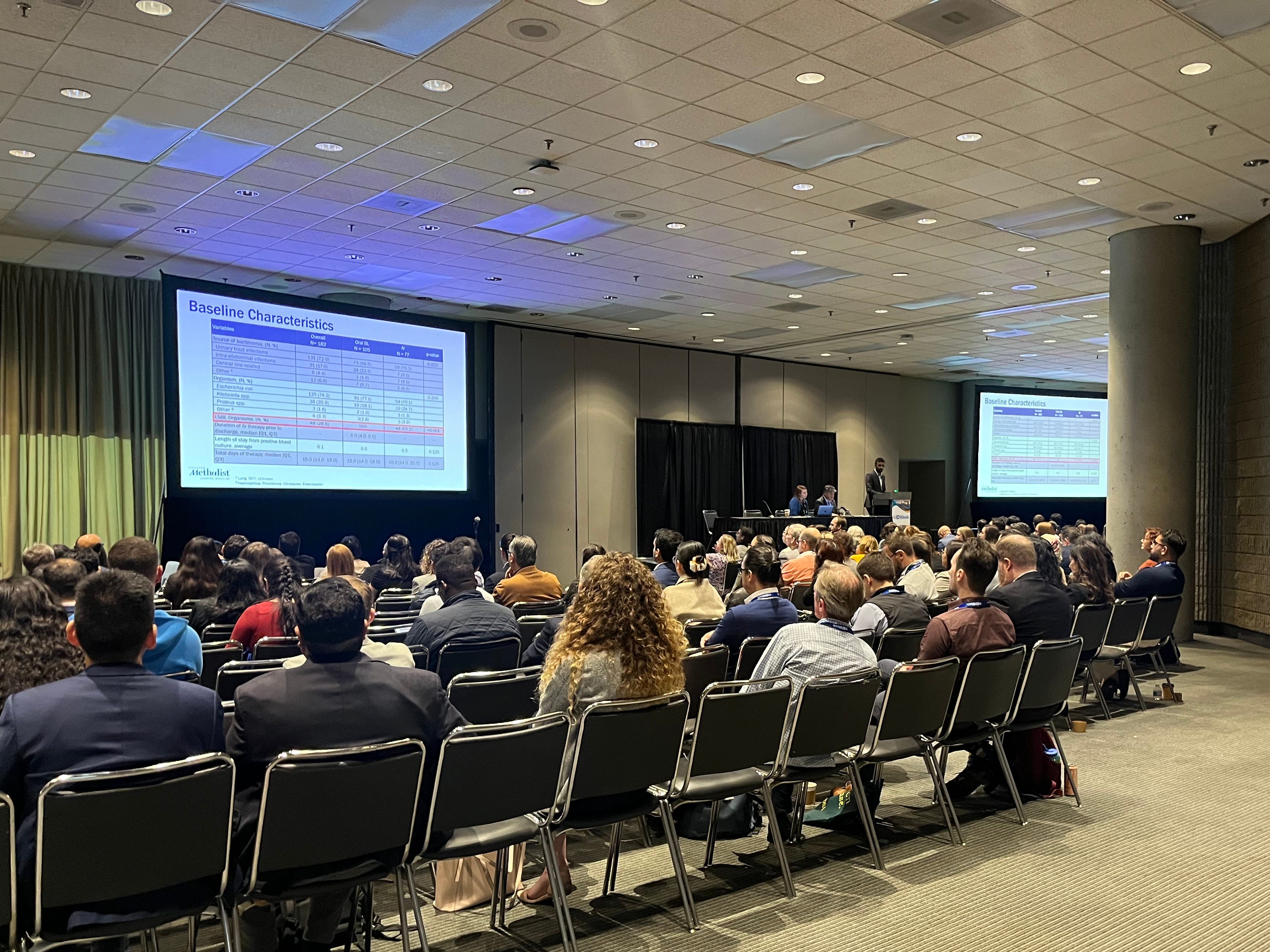 IDWeek attendees watch a presentation.