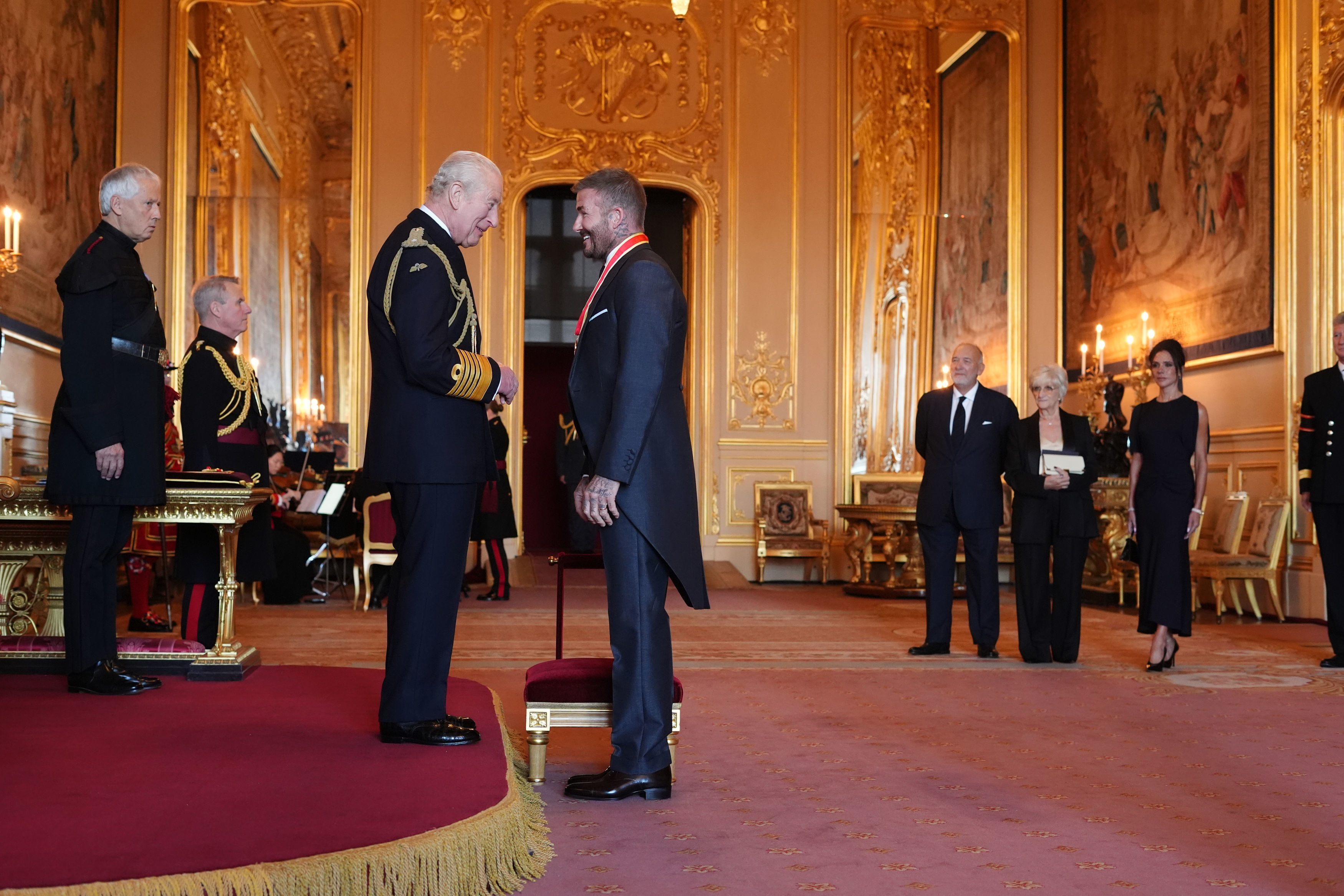Sir David Beckham is made a Knight Bachelor by Britain's King Charles III.