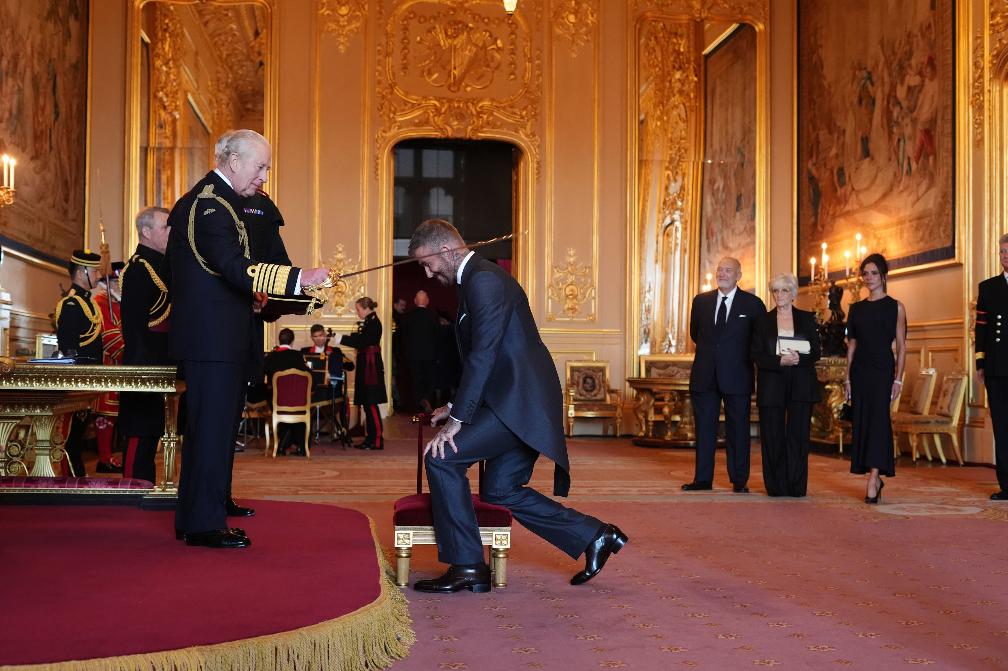 Sir David Beckham is made a Knight Bachelor by Britain's King Charles III.
