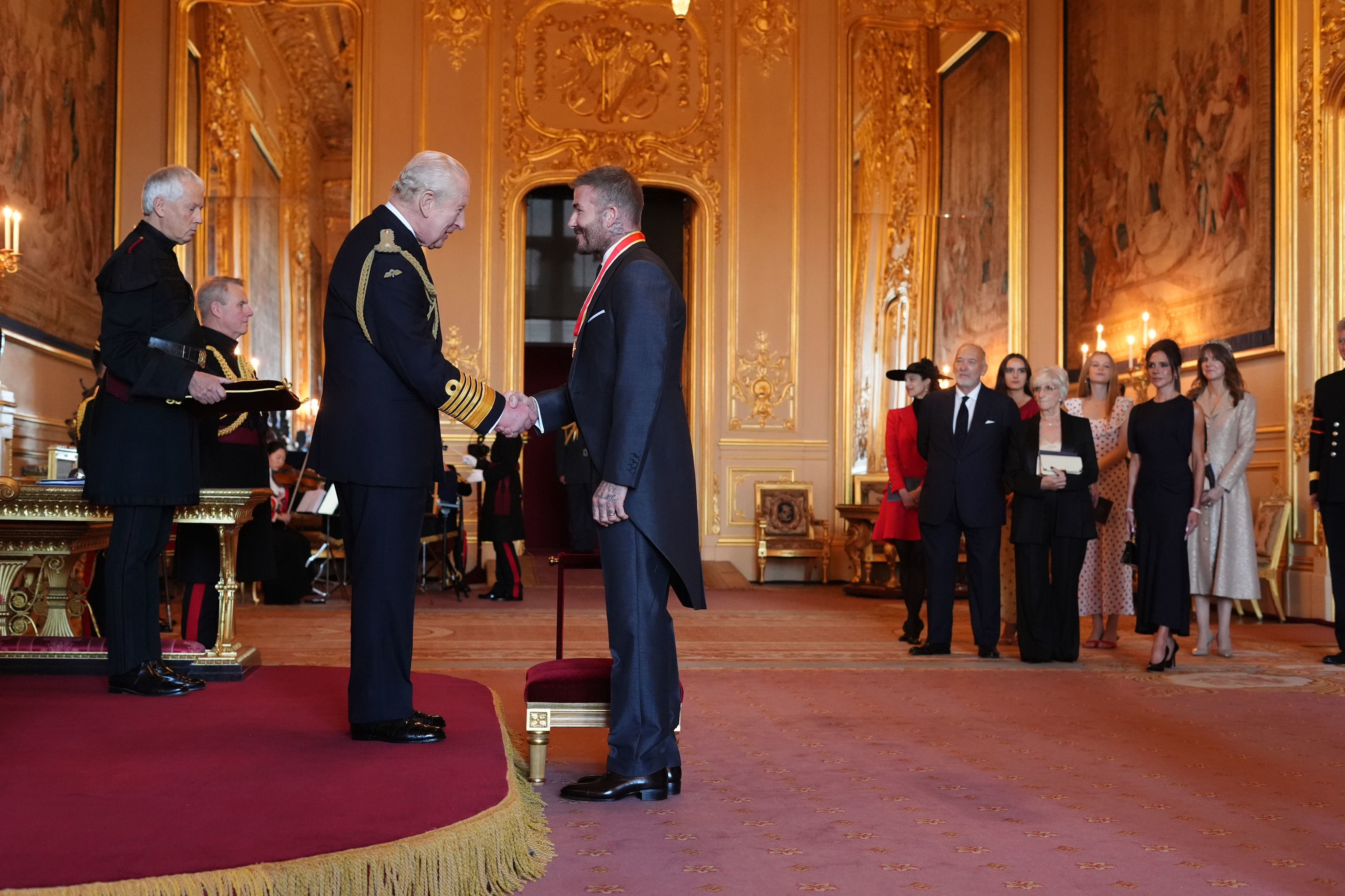 Sir David Beckham is made a Knight Bachelor by Britain's King Charles III.
