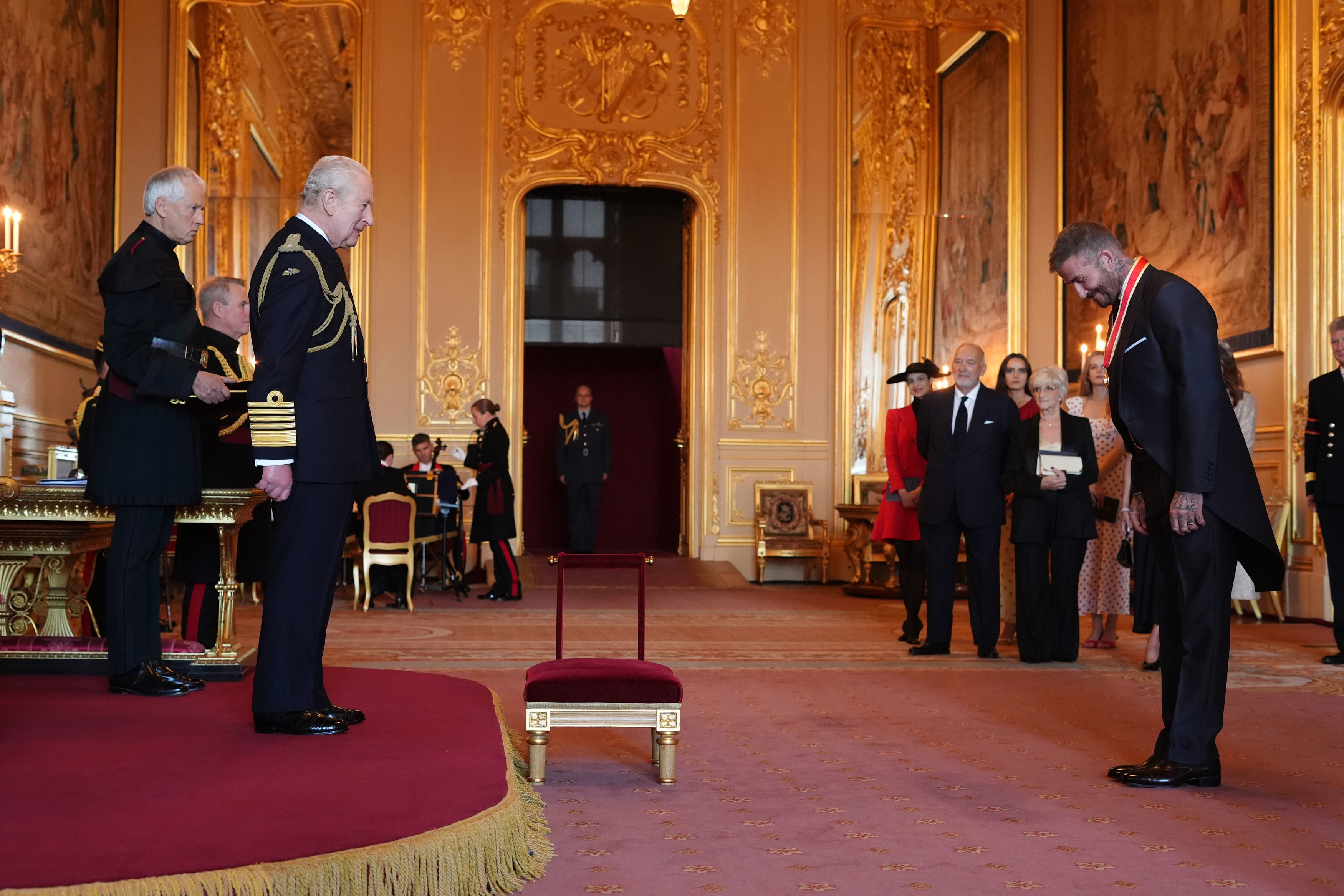 Sir David Beckham is made a Knight Bachelor by Britain's King Charles III.