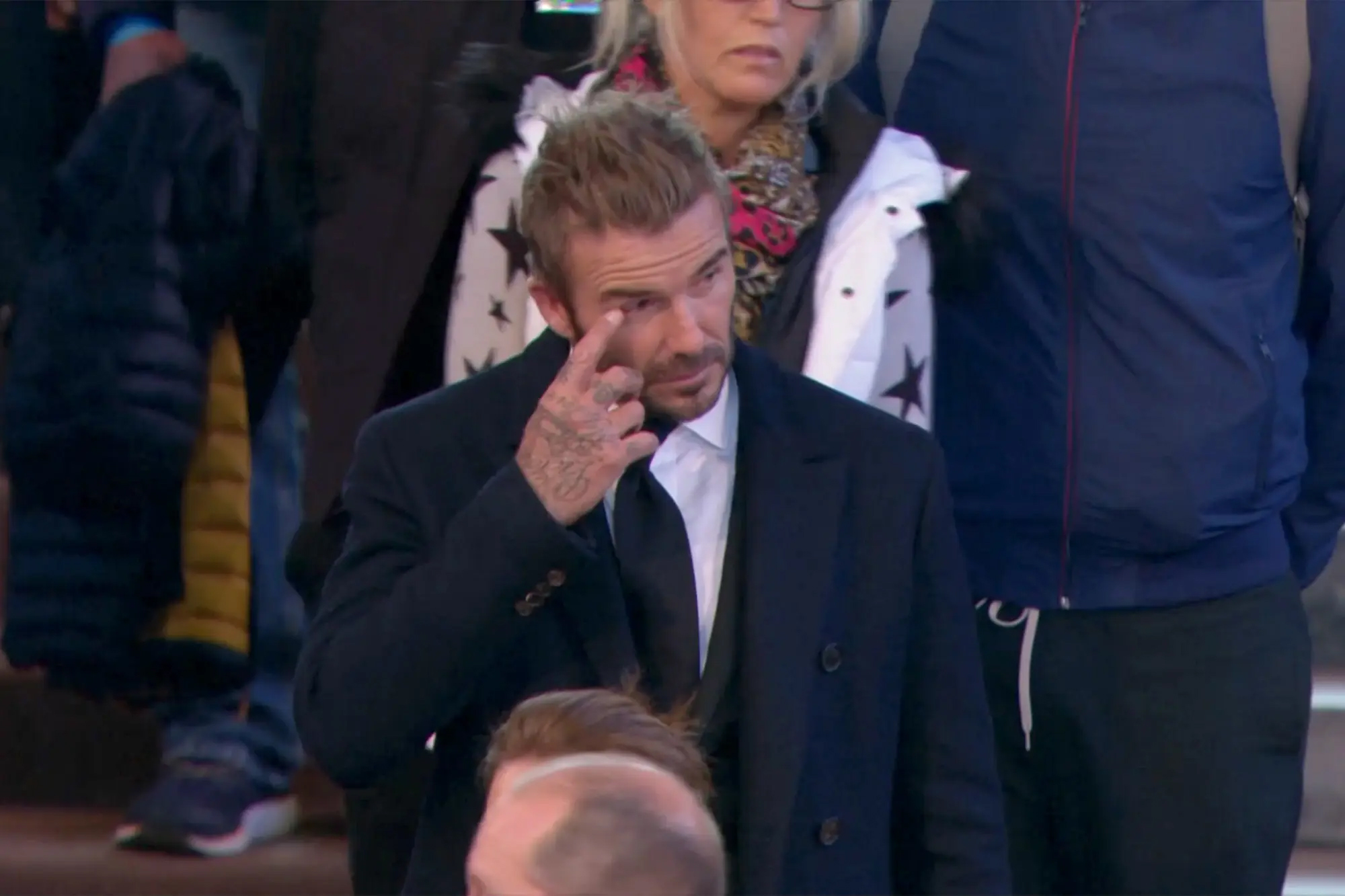 David Beckham waiting in line to view the Queen's casket.