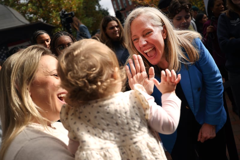Virginia Democratic gubernatorial nominee former Rep. Abigail Spanberger greets Brittany Whitley and her daughter Amelia during a rally at Virginia Commonwealth University on November 3, 2025 in Richmond, Virginia.
