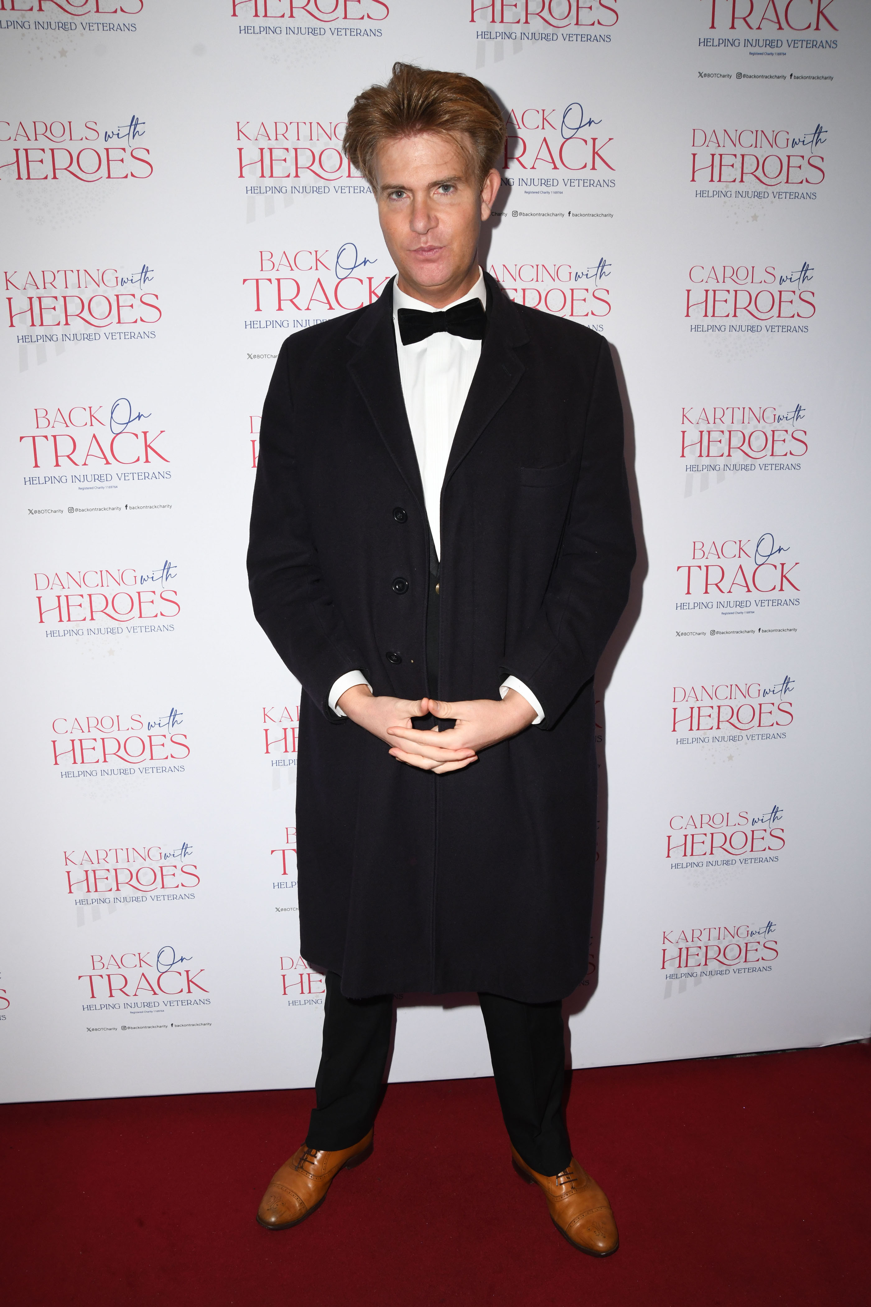 Ben Duncan posing at the Dancing with Heroes Ball.