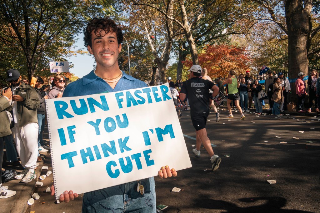 A man holding a sign that says