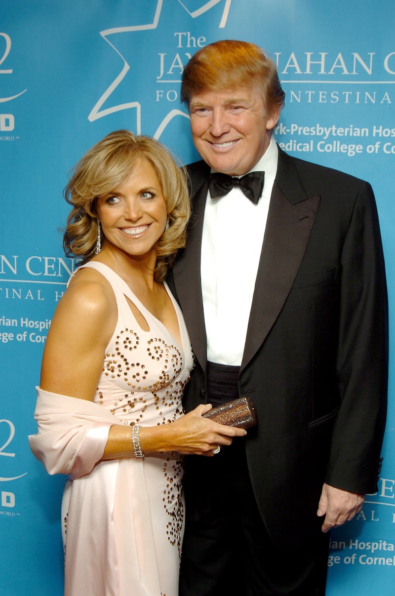 Katie Couric and Donald Trump attend a charity gala benefit on the Queen Mary 2 ocean liner in New York City on April 24, 2004.