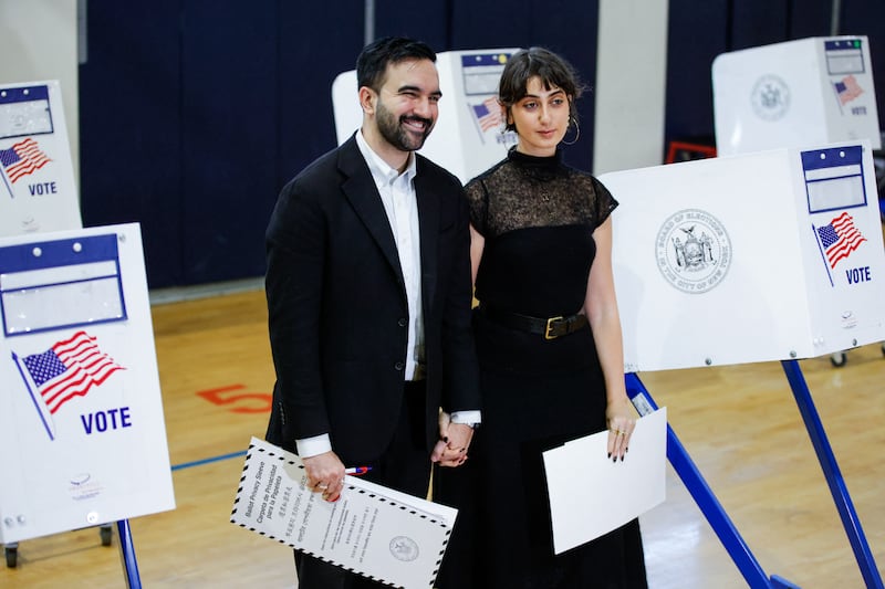 Democratic New York City mayoral noiminee Zohran Mamdani with his wife Rama Duwaji after they voted at a polling location at Frank Sinatra School of Arts in the Queens borough of New York City on November 4, 2025.