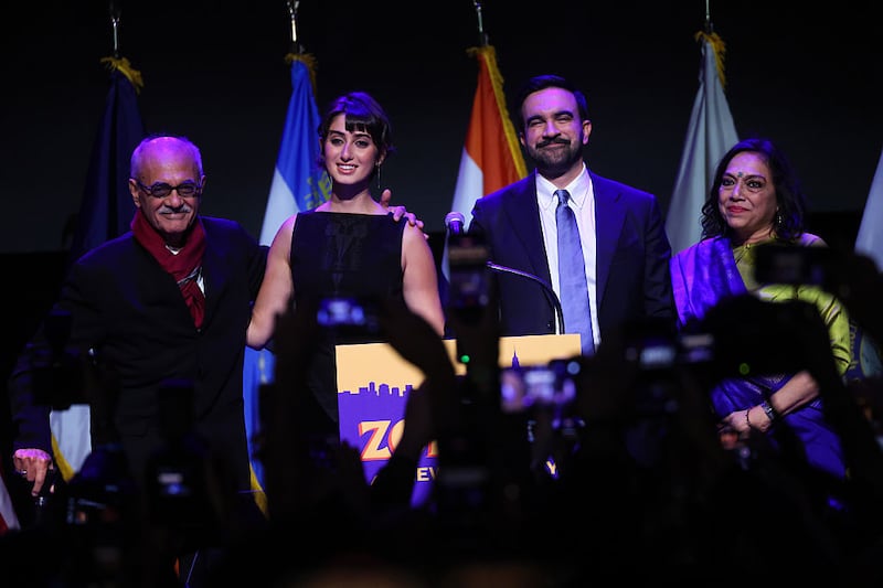 New York City Democratic mayoral candidate Zohran Mamdani (2nd-R) stands with his wife Rama Duwaji (2nd-L) alongside his parents Mahmood Mamdani (L) and Mira Nair (R) after delivering remarks at his election night watch party at the Brooklyn Paramount on November 4, 2025 in the Brooklyn borough of New York City.