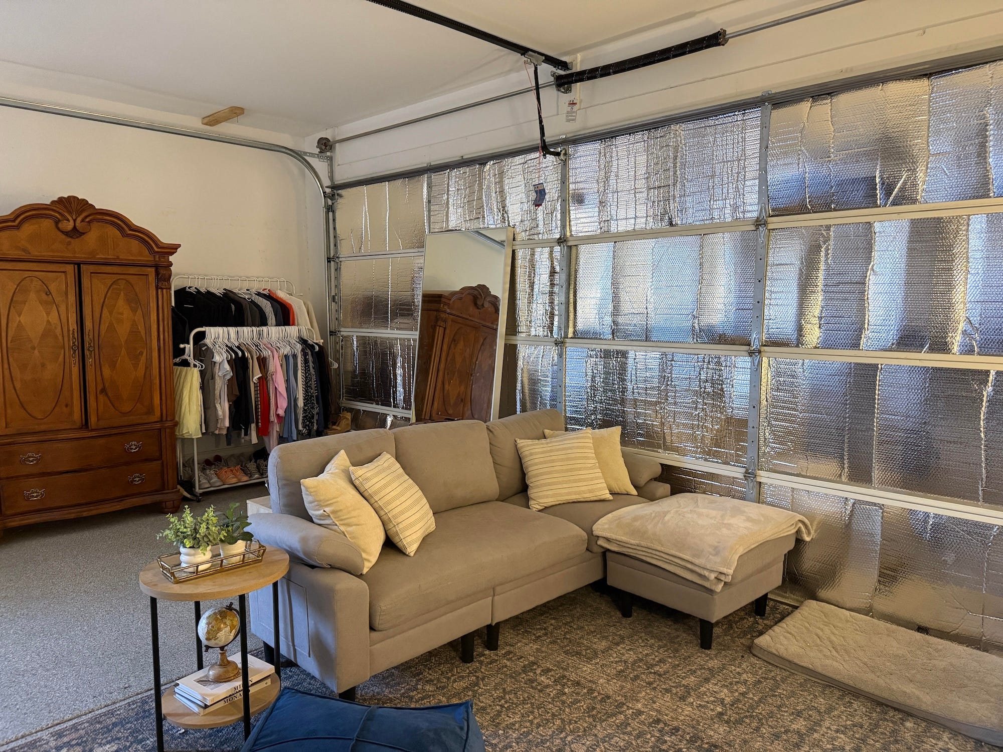 A living room set up in a garage.