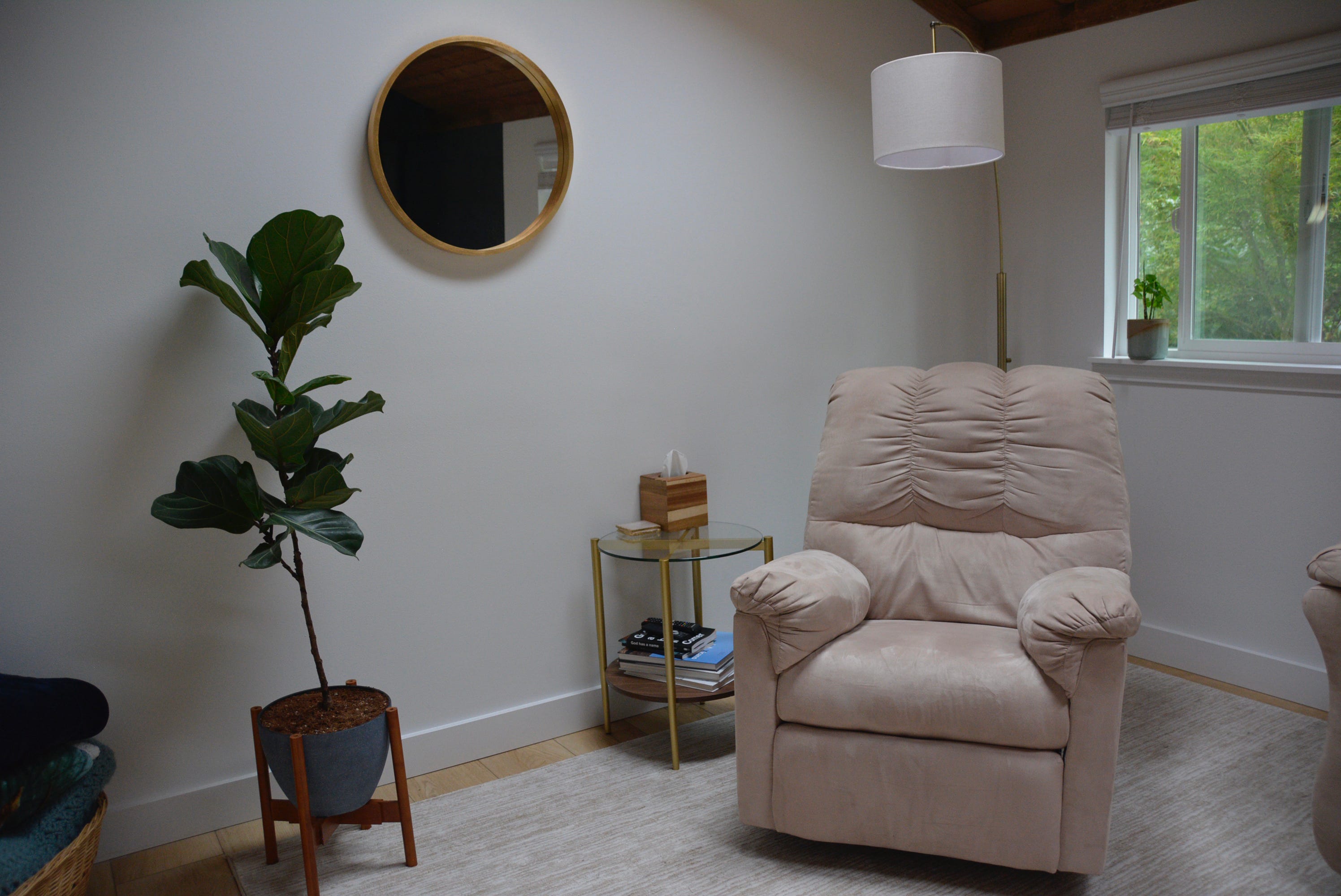 Beige armchair next to lamp